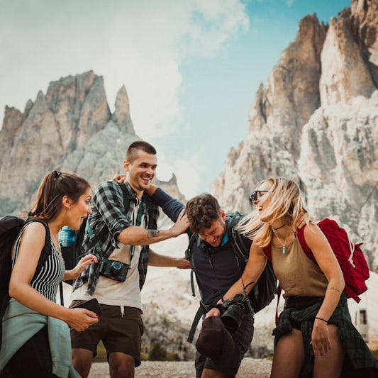 Group of hikers with backpacks in a mountainous area