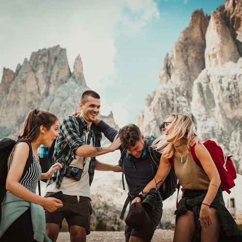 Group of hikers with backpacks in a mountainous area